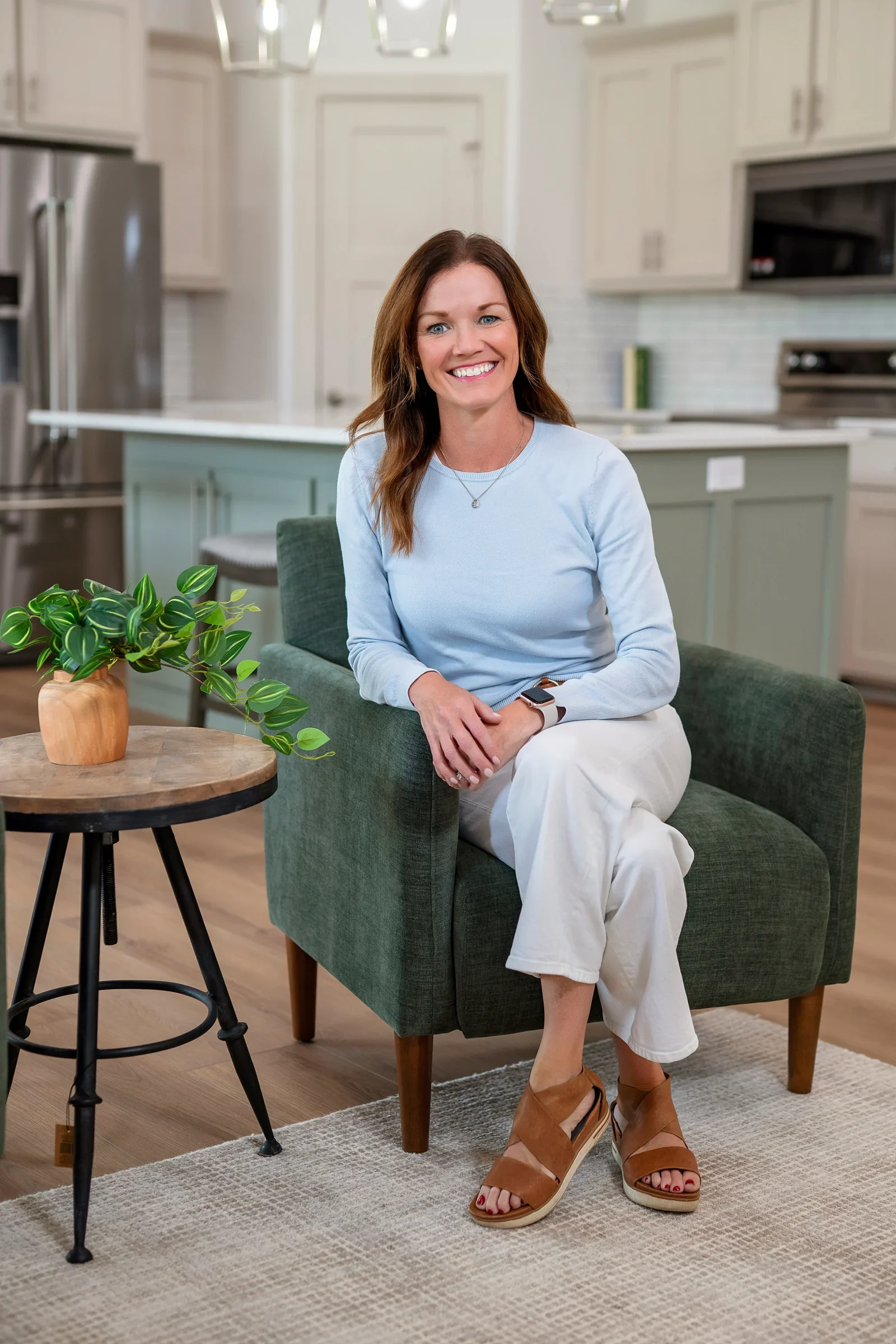 Anne M. Steele seated in a bright kitchen