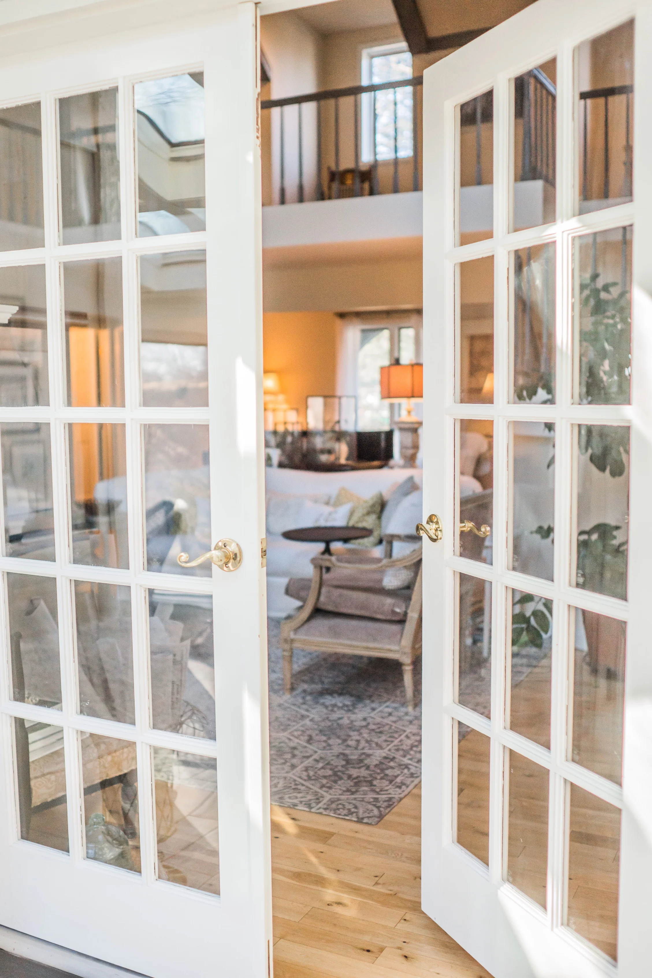 French doors opening into a bright, welcoming living room