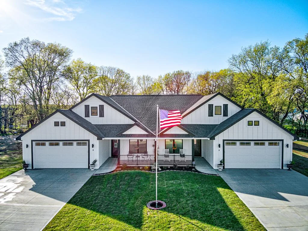 A white farmhouse with a welcoming front porch