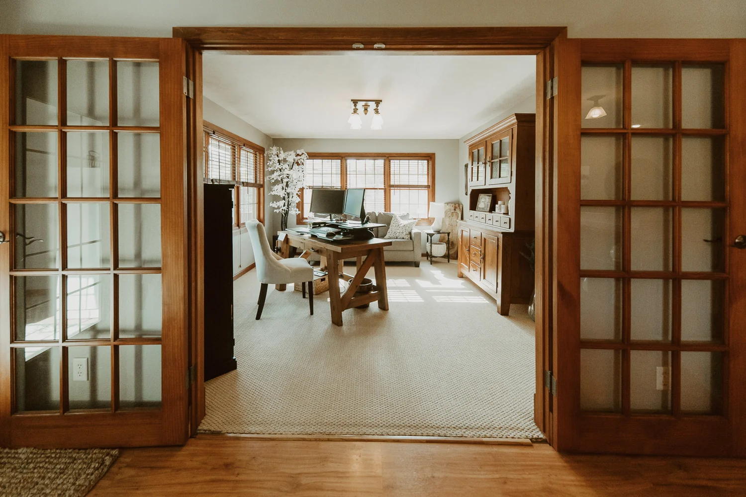 A warm, well-kept living space framed by French doors